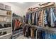 Spacious walk-in closet with custom shelving and ample storage space for clothes and shoes at 12516 W Mclellan Ct, Glendale, AZ 85307