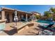 Outdoor paradise boasting a refreshing pool, bar area, and relaxing patio setup at 13629 W San Miguel Ave, Litchfield Park, AZ 85340