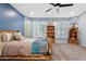 Spacious bedroom with a ceiling fan, light blue walls, and carpet flooring at 13629 W San Miguel Ave, Litchfield Park, AZ 85340