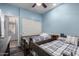' bedroom featuring two twin beds, ceiling fan, neutral colored walls, and plenty of space at 13629 W San Miguel Ave, Litchfield Park, AZ 85340
