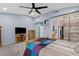 Bedroom featuring wood furniture, blue accent wall, and carpet flooring at 13629 W San Miguel Ave, Litchfield Park, AZ 85340