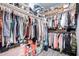 Organized walk-in closet featuring ample hanging space, shelving, and storage for clothes, shoes, and accessories at 13629 W San Miguel Ave, Litchfield Park, AZ 85340