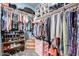 Bright walk-in closet with storage for shoes, shelves, and clothing racks to maximize organization and convenience at 13629 W San Miguel Ave, Litchfield Park, AZ 85340