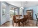 An eat-in dining area featuring a sliding glass door leading to the patio at 13629 W San Miguel Ave, Litchfield Park, AZ 85340