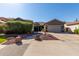 Charming single-story home with a well-manicured front yard and a two-car garage at 13629 W San Miguel Ave, Litchfield Park, AZ 85340