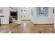 Elegant foyer with marble flooring, and access to the living room at 13629 W San Miguel Ave, Litchfield Park, AZ 85340