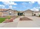 Charming single-story home with a well-manicured front yard and a two-car garage at 13629 W San Miguel Ave, Litchfield Park, AZ 85340