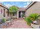 Inviting front porch with cozy seating area, creating a relaxing outdoor space at 13629 W San Miguel Ave, Litchfield Park, AZ 85340
