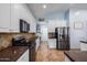 Charming kitchen featuring stainless steel appliances, granite countertops, and ample cabinet space at 13629 W San Miguel Ave, Litchfield Park, AZ 85340