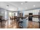 Open eat-in kitchen featuring tile floors, a center island, and white cabinetry at 13629 W San Miguel Ave, Litchfield Park, AZ 85340