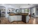 Open kitchen area with granite countertop bar, and an eat-in dining space at 13629 W San Miguel Ave, Litchfield Park, AZ 85340