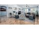 Inviting living room with tile flooring, a decorative TV console, and ample seating at 13629 W San Miguel Ave, Litchfield Park, AZ 85340