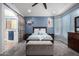 Stylish bedroom with soft blue accents and an attached bathroom at 13629 W San Miguel Ave, Litchfield Park, AZ 85340