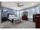 Spacious bedroom with a ceiling fan and comfortable furnishings at 13629 W San Miguel Ave, Litchfield Park, AZ 85340