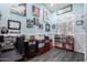 Dedicated office space, features a desk, artwork, and storage for an efficient and inviting workspace at 13629 W San Miguel Ave, Litchfield Park, AZ 85340