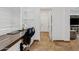 Bright office space with built-in desk, overhead storage, and natural light from the window at 13629 W San Miguel Ave, Litchfield Park, AZ 85340