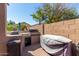 Outdoor kitchen features a built-in grill and countertop space, perfect for entertaining friends and Gathering at 13629 W San Miguel Ave, Litchfield Park, AZ 85340