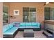 Covered patio with outdoor seating, plush cushions, and hot tub at 13629 W San Miguel Ave, Litchfield Park, AZ 85340