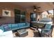 Inviting covered patio with comfortable seating, ceiling fan, and a relaxing hot tub at 13629 W San Miguel Ave, Litchfield Park, AZ 85340