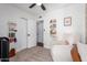 Cozy bedroom with a comfortable armchair, a crib, and a convenient door at 15038 N 22Nd St, Phoenix, AZ 85022