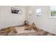 Bright bedroom featuring wood floors, white walls, and modern decor at 15038 N 22Nd St, Phoenix, AZ 85022