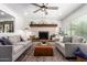 Bright living room with a fireplace, comfortable seating, and ample natural light at 15038 N 22Nd St, Phoenix, AZ 85022