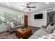 Comfortable living room with a ceiling fan, plush seating, and hardwood floors at 15038 N 22Nd St, Phoenix, AZ 85022