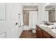 Bright bathroom featuring tile shower, granite vanity, and dark wood floors at 15252 N 100Th St # 1147, Scottsdale, AZ 85260