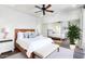 Bright main bedroom features a mirrored closet, ceiling fan, and ensuite bathroom at 15252 N 100Th St # 1147, Scottsdale, AZ 85260