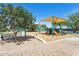 Fun community playground area with slides, climbers, and shade, ideal for outdoor activities at 15252 N 100Th St # 1147, Scottsdale, AZ 85260