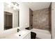 Nicely remodeled bathroom featuring granite countertops, black hardware, and stone shower at 15801 N 29Th N St # 20, Phoenix, AZ 85032