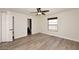 Spacious bedroom featuring light wood floors, a window, and a ceiling fan with a light at 15801 N 29Th N St # 20, Phoenix, AZ 85032