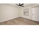 Spacious bedroom featuring light wood floors, a window, and a ceiling fan with a light at 15801 N 29Th N St # 20, Phoenix, AZ 85032