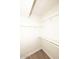 Clean white walk-in closet with shelf and rod system for optimal storage and organization at 15801 N 29Th N St # 20, Phoenix, AZ 85032