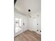 Welcoming entryway with wood-look floors, pendant lighting, and easy access to the patio at 15801 N 29Th N St # 20, Phoenix, AZ 85032