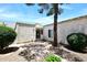 Charming single-story home featuring a gated entrance, textured walls, and mature landscaping at 15801 N 29Th N St # 20, Phoenix, AZ 85032