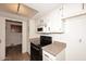 Kitchen includes white cabinets, laminate countertops, and modern appliances at 15801 N 29Th N St # 20, Phoenix, AZ 85032