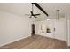 Bright living room featuring wood floors, vaulted ceilings, ceiling fan, and patio access at 15801 N 29Th N St # 20, Phoenix, AZ 85032