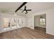 Spacious living room boasts wood floors, a ceiling fan, vaulted ceilings, and ample natural light at 15801 N 29Th N St # 20, Phoenix, AZ 85032