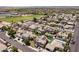 Expansive aerial view of a residential neighborhood, showcasing rooftops, streetscapes, and community baseball fields at 16071 W Sherman St, Goodyear, AZ 85338