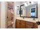 This bathroom has a double sink, a bathtub and updated finishes at 16071 W Sherman St, Goodyear, AZ 85338