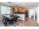 Open kitchen and dining area with granite counters, stainless appliances, and tile floors at 16071 W Sherman St, Goodyear, AZ 85338