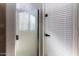 This walk-in shower features clear glass, a shower door, and updated faucet at 16071 W Sherman St, Goodyear, AZ 85338