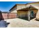 Private backyard with wrought iron gate and a covered patio. Perfect for entertaining at 16141 N 183Rd Dr, Surprise, AZ 85388