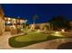 Enjoy a putting green, outdoor kitchen and bar area in this private backyard at 16141 N 183Rd Dr, Surprise, AZ 85388