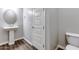Powder bath features a pedestal sink, tiled flooring and modern fixtures at 16141 N 183Rd Dr, Surprise, AZ 85388