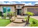 Inviting front entrance with desert landscaping, brick walkway and decorative front door at 16141 N 183Rd Dr, Surprise, AZ 85388