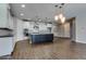 Beautiful kitchen with white cabinetry, a stylish island, stainless appliances, and tiled backsplash at 16141 N 183Rd Dr, Surprise, AZ 85388