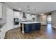 Modern kitchen boasts stainless appliances, subway tile backsplash, and a large island with stone countertops at 16141 N 183Rd Dr, Surprise, AZ 85388