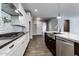 This open kitchen offers stainless steel appliances, lots of counter space, a large island, and tile flooring at 16141 N 183Rd Dr, Surprise, AZ 85388